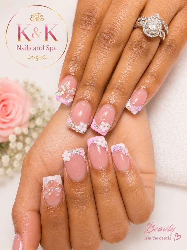 Iridescent bow and rhinestone nail design