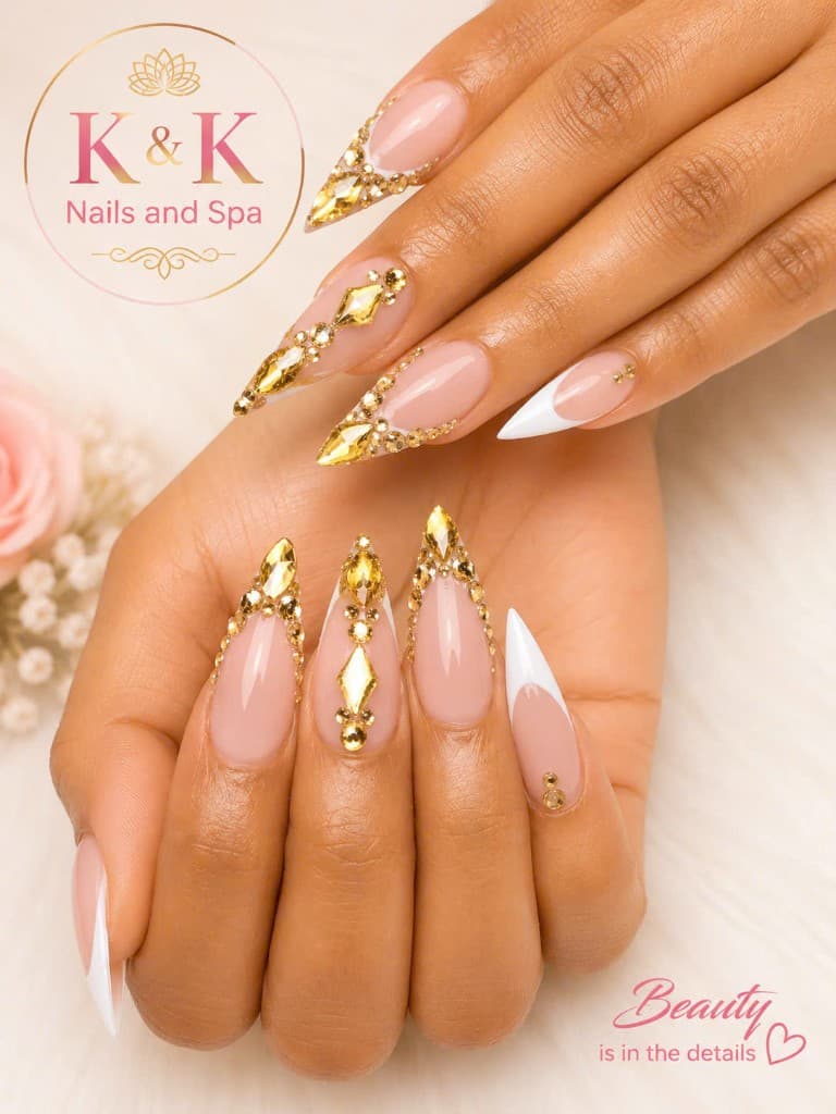Gold gem stiletto nail design